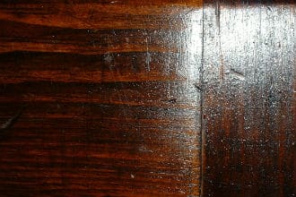 This shows wood scratched due to sanding against the grain of wood fibers.