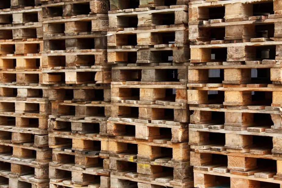 This picture shows a collection of wooden pallets with some cleaner than others.