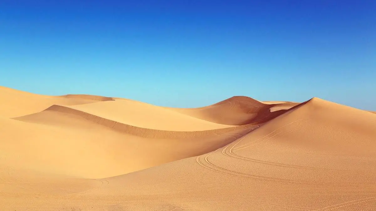Sand dunes with blue sky