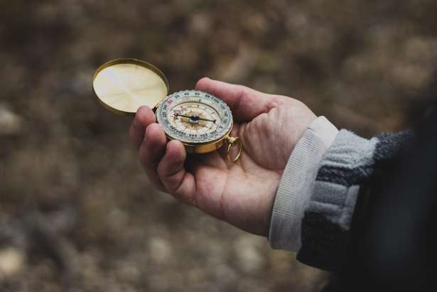 Person holding compass