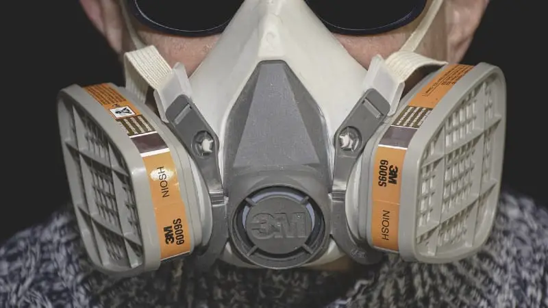 Man with respirator - 31 Helpful Tips For Woodworking With A Jigsaw