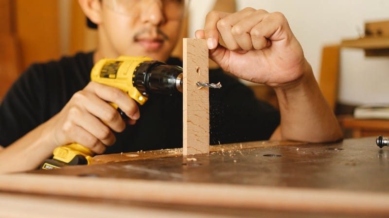 Man drilling wood