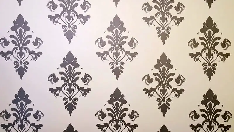 A close-up of a perfectly executed wall stencil pattern, showcasing the crisp, clean lines and precision of a flawless stenciling technique.